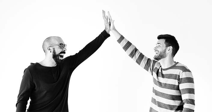 Two men giving a high five 2022 12 16 01 13 57 utc.jpg